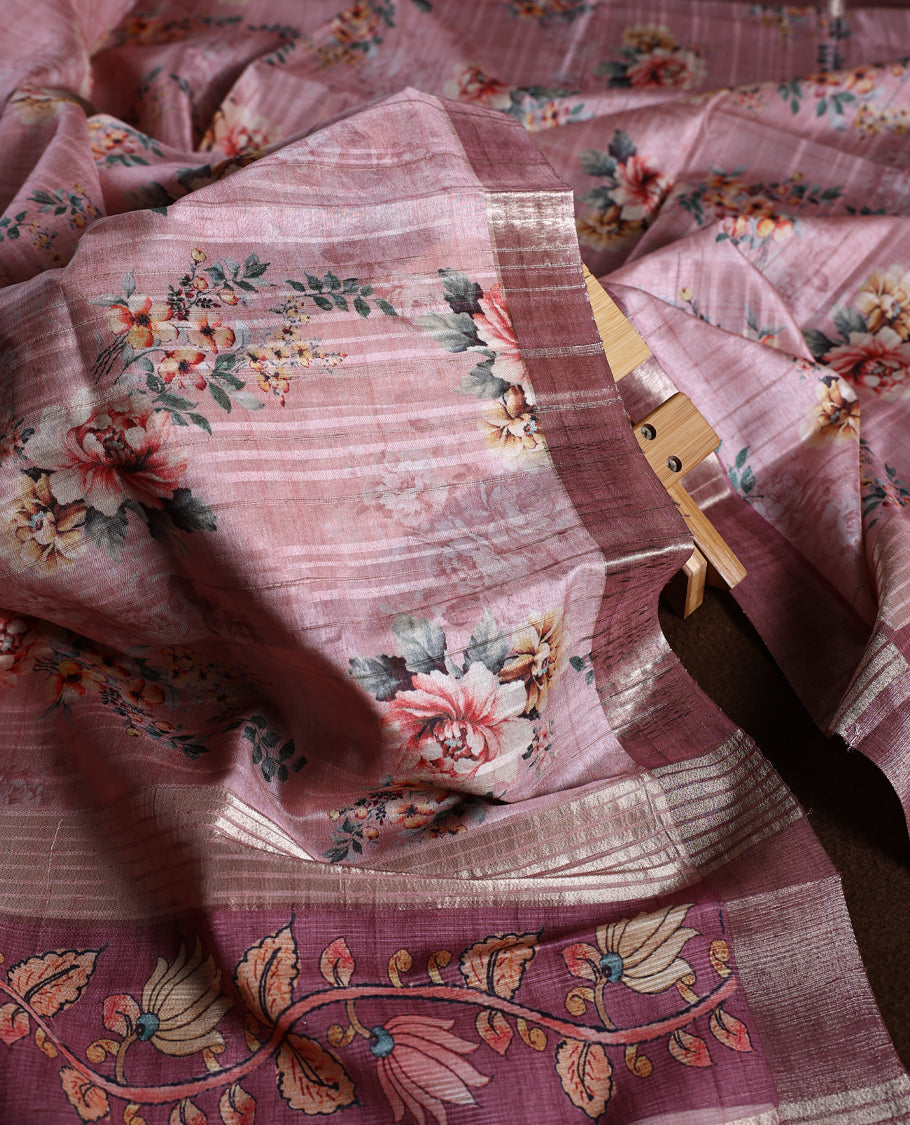 Onion pink colour churidhar material adorned with floral embroidery and sewn glass beads on the yoke, paired with a plain bottom and same colour dupatta featuring floral prints.