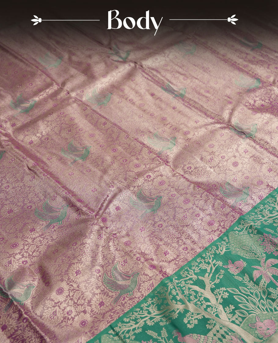 Pastel purple colour and Antique gold check Zari Tissue Brocade Saree features intricate bird Motifs on body and green colour fancy border & pallu with forest patterns, paired with matching blouse
