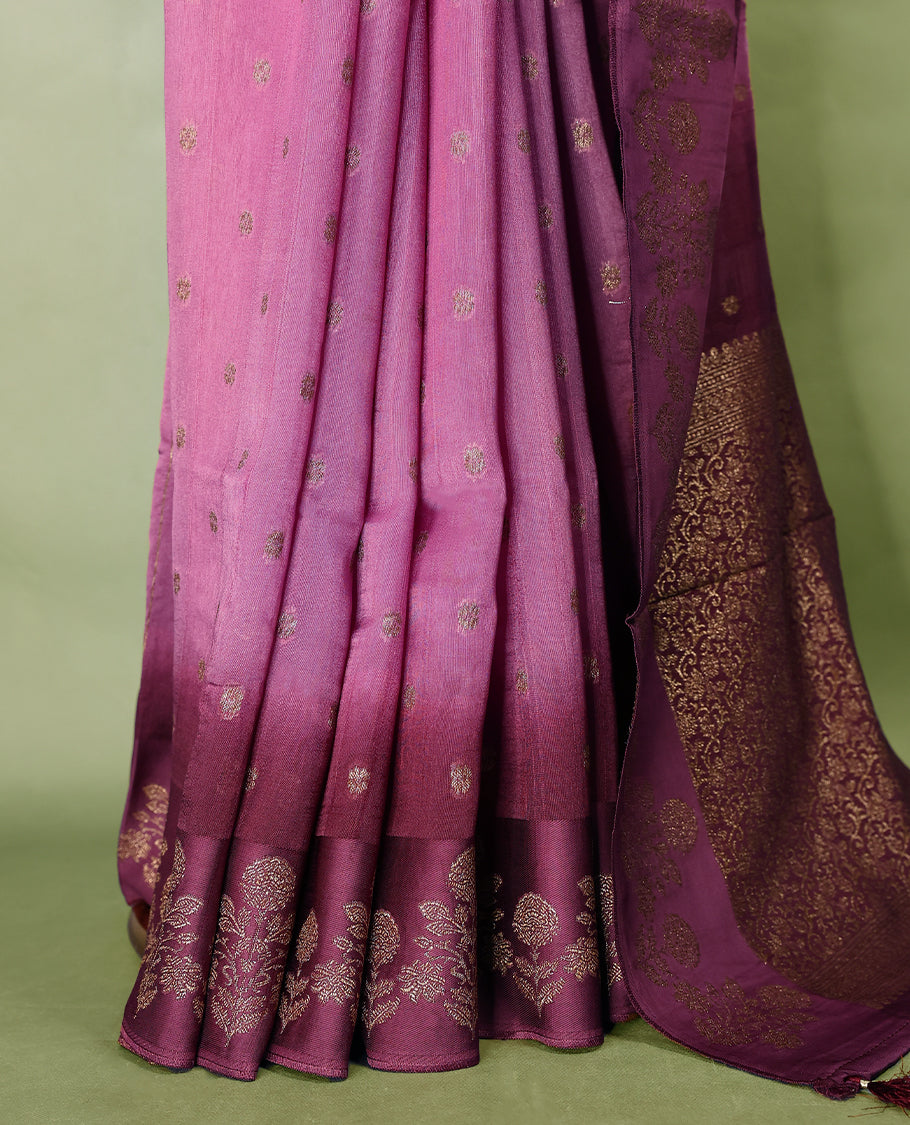 Onion pink and grape wine double shade semi Banaras Tussar Georgette saree adorned with elegant antique gold zari floral motifs across the body, featuring a detailed woven border and grand pallu, paired with a matching blouse piece.