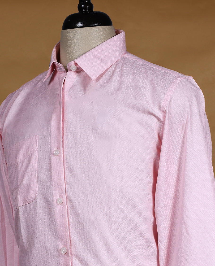 Soft baby pink Peter Eglend men’s shirt in a slim fit silhouette, featuring a subtle textured finish with full sleeves, classic collar, and chest pocket perfect for modern office and semi formal wear
