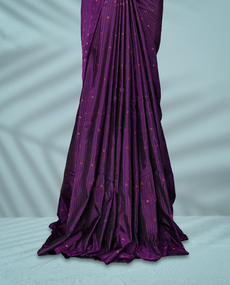 Deep violet colour semi silk saree with fine copper zari stripes and dotted motifs across the body, without have a border, Comes with a matching blouse.