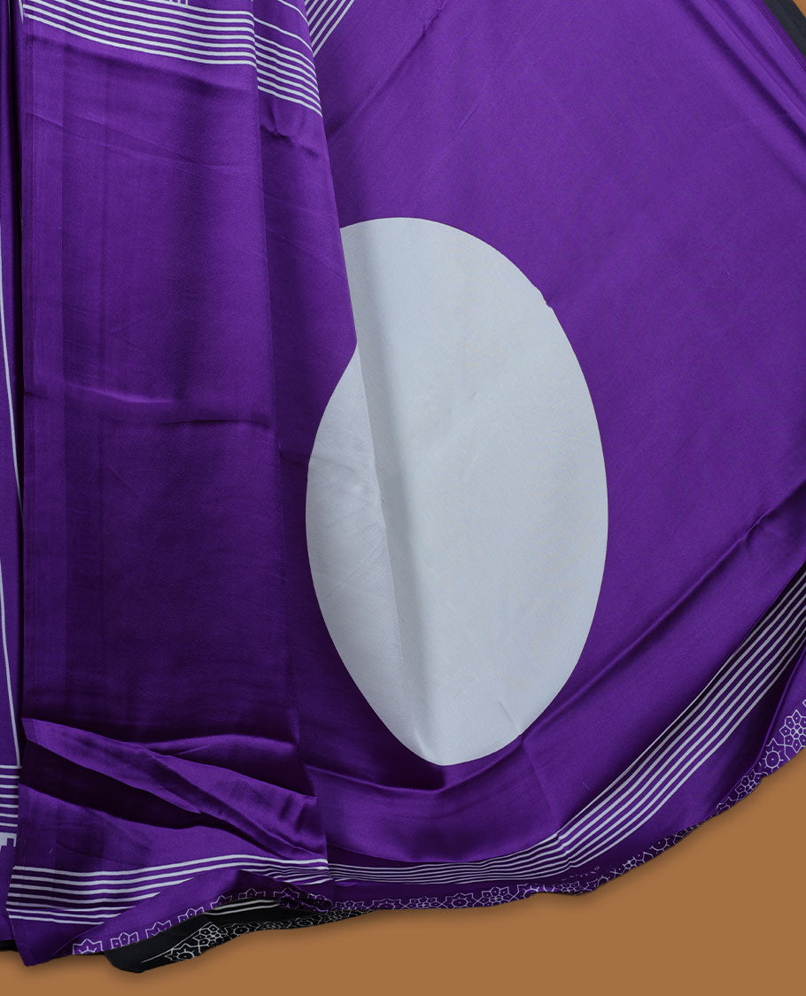 Violet colour semi modal saree featuring white colour geometric borders and fine stripe detailing, finished with an oversized circular motif on the pallu, paired with a matching printed blouse.
