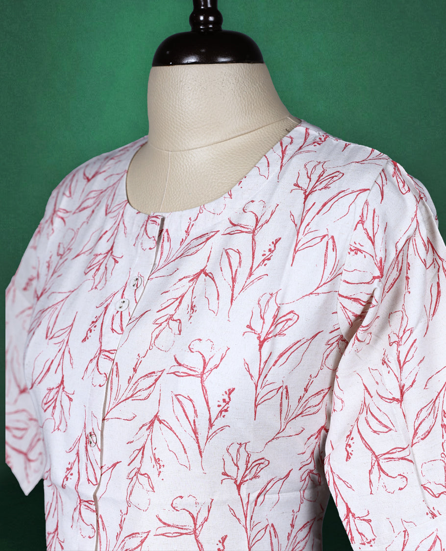 Beige colour cotton kurti adorned with delicate red leaf prints, featuring a round neckline, short sleeves, and a straight cut silhouette a breezy and elegant pick for casual and daily wear.