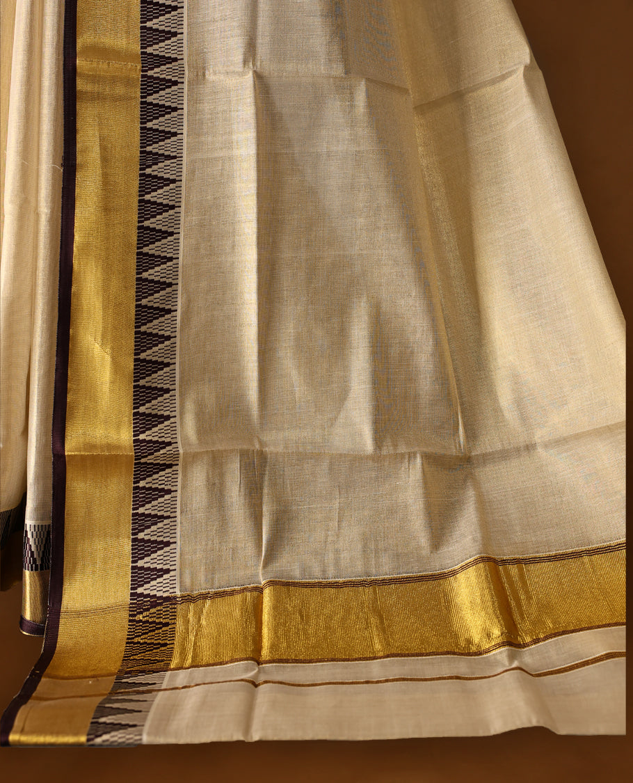 Elegant Light Gold colour Tissue Kerala saree featuring Plain body and traditional golden zari kasavu border with chocolate colour temple work offering a classic and graceful look, paired with a matching blouse.