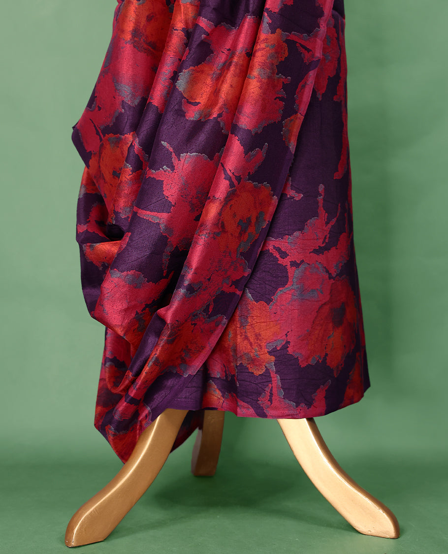 Dark plum colour Manipuri saree featuring oversized crimson and burnt orange floral motifs, finished without a border, and paired with a matching blouse.