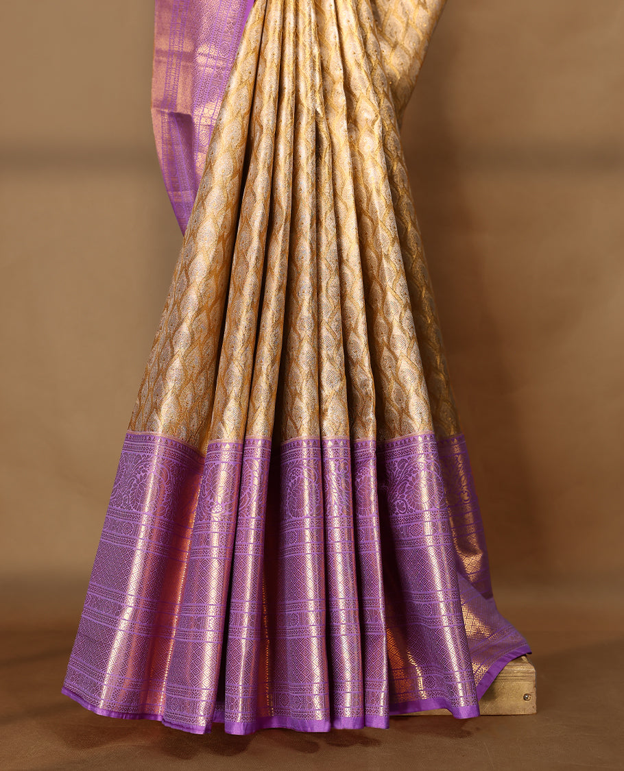 Gold colour tissue brocade saree with gold and silver zari pattern on body, gold zari traditional floral kodi work lavender border, rich matching pallu with Antique zari motifs, paired with matching blouse.