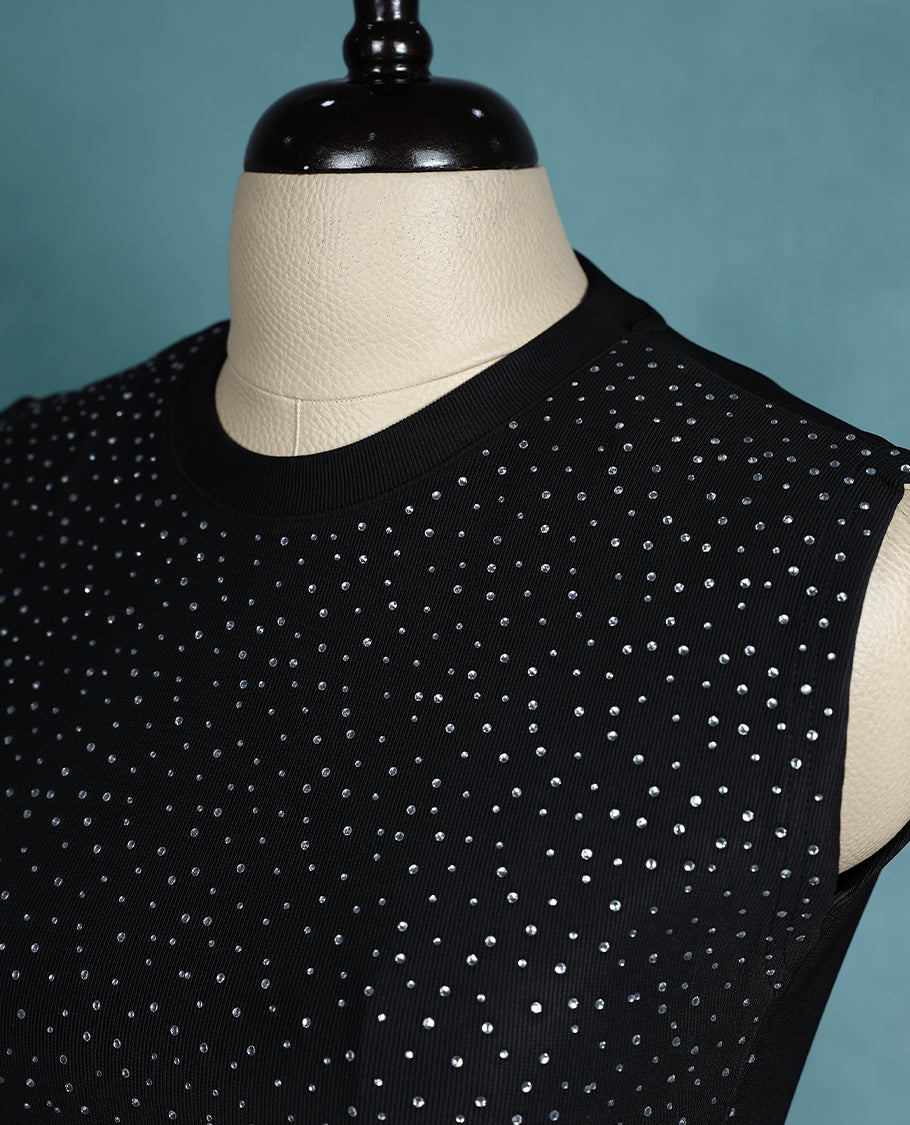 Black colour sleeveless crop top featuring a ribbed crew neck and all over stud embellishments, offering a chic and edgy look