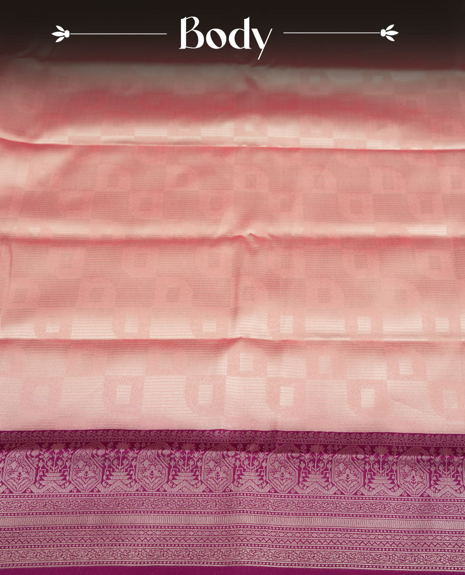 Pastel pink colour semi silk saree adorned with silver zari designs on the body, complemented by a contrasting purple border and pallu, and paired with a matching blouse piece.