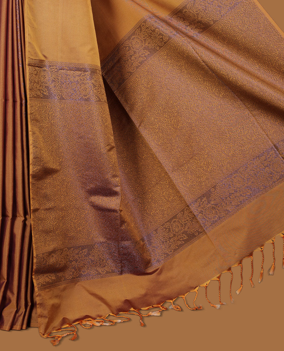 Mustard colour semi soft silk saree adorned with delicate woven floral kodi motifs on the body, complemented by a Self colour woven pallu with intricate detailing and tassel accents without border & Comes with a matching blouse piece.