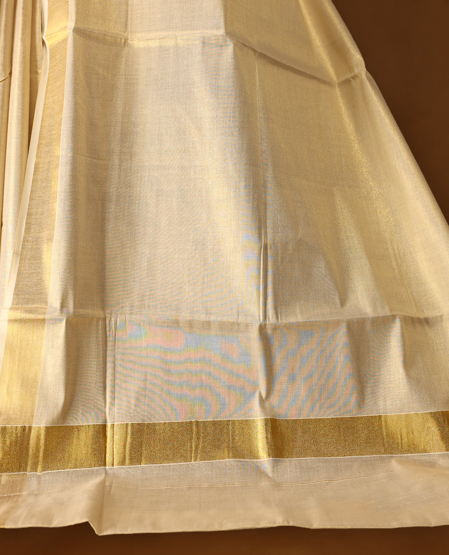 Elegant Light Gold colour Tissue Kerala saree featuring Plain body and traditional golden zari 2.5 Inch kasavu border offering a classic and graceful look, paired with a matching blouse.