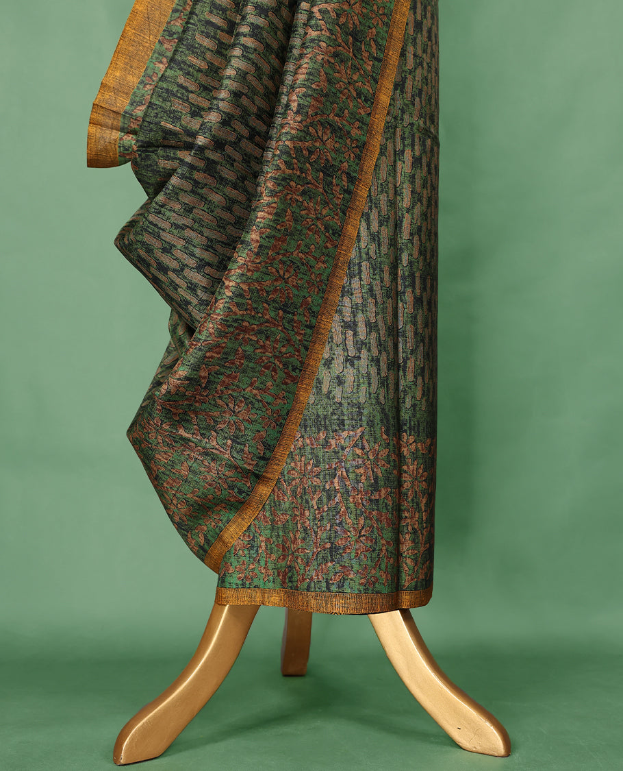Deep green colour Manipuri saree features a body adorned with intricate Block motifs, complemented by a rich golden yellow Floral Printed border, and comes with a matching blouse.