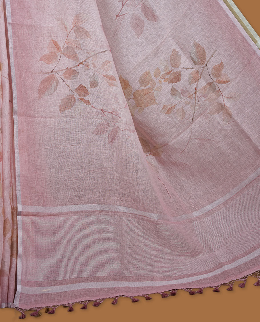 Light pink colour pure linen saree featuring leaf print pattern across body, silver thin border finished with matching blouse.