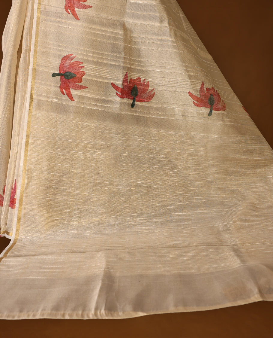 Elegant off white colour organza Kerala saree with golden sheen and floral prints, paired with a matching blouse, Features a flowy texture and tasselled pallu, Perfect for festive, casual, or semi-formal occasions.