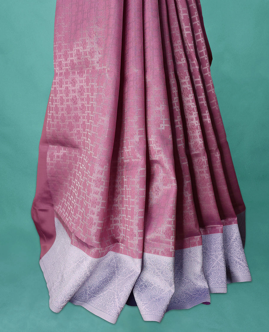 Pink coloured semi silk saree featuring a Zari design on the body, paired with a Baby Blue coloured border and matching blouse.