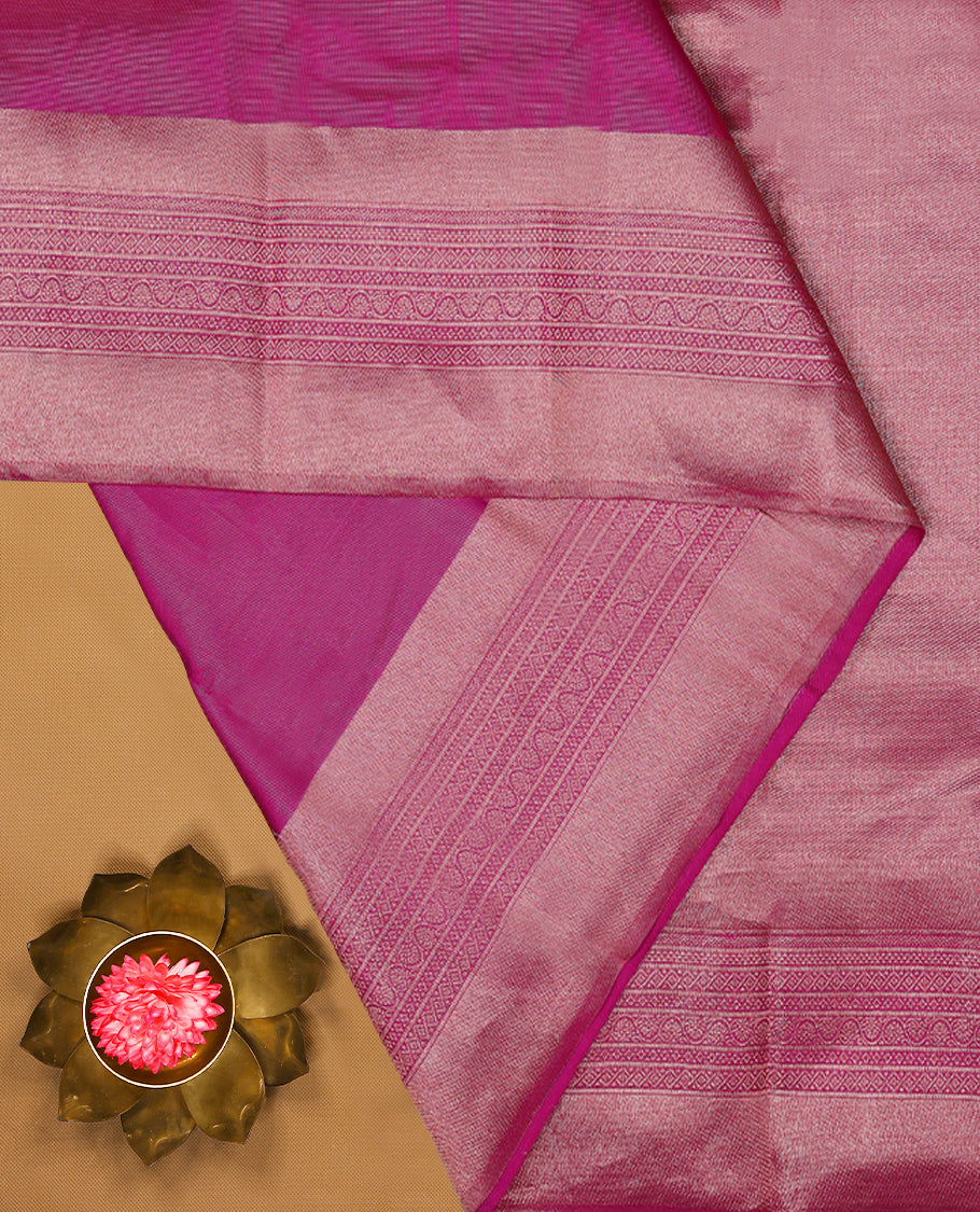 Pink Colour Manthrakodi saree featuring tissue weaving with a plain body, complemented by a self coloured traditional border and a matching self coloured blouse.