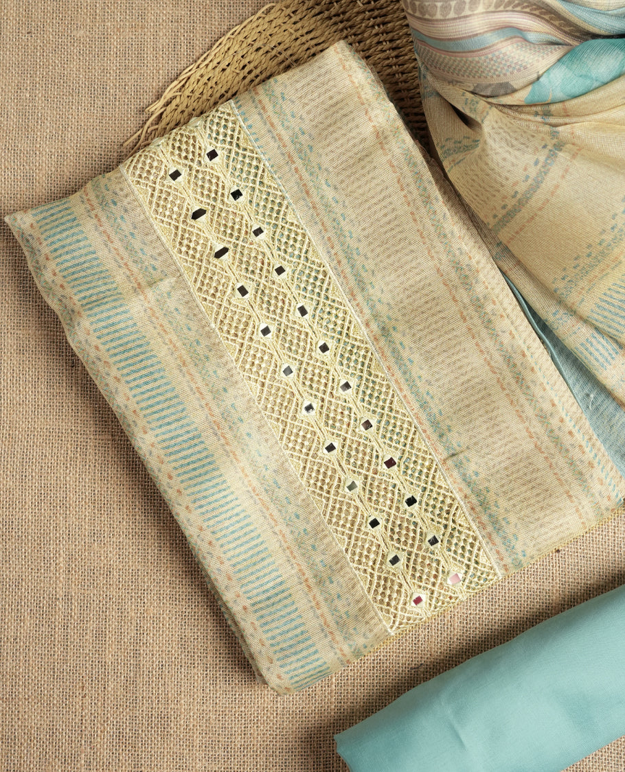 Sky blue and beige colour suit material with delicate woven mirror work patterns and subtle zari detailing & Includes a soft dupatta with a floral touch and plain matching bottom.
