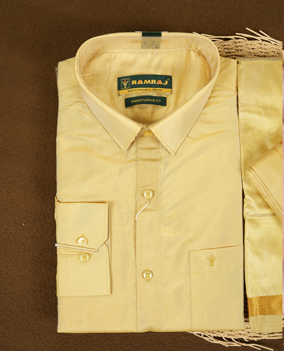 Dark Gold Colour shirt by RAMRAJ paired with a matching dhoti, all elegantly finished with a gold border.