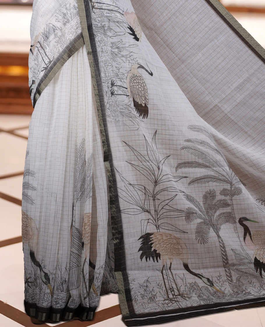 Off white colour Soft cotton saree featuring elegant bird prints along the edges, a stylish checked body, and a beautifully designed black border & Paired with a matching blouse piece.