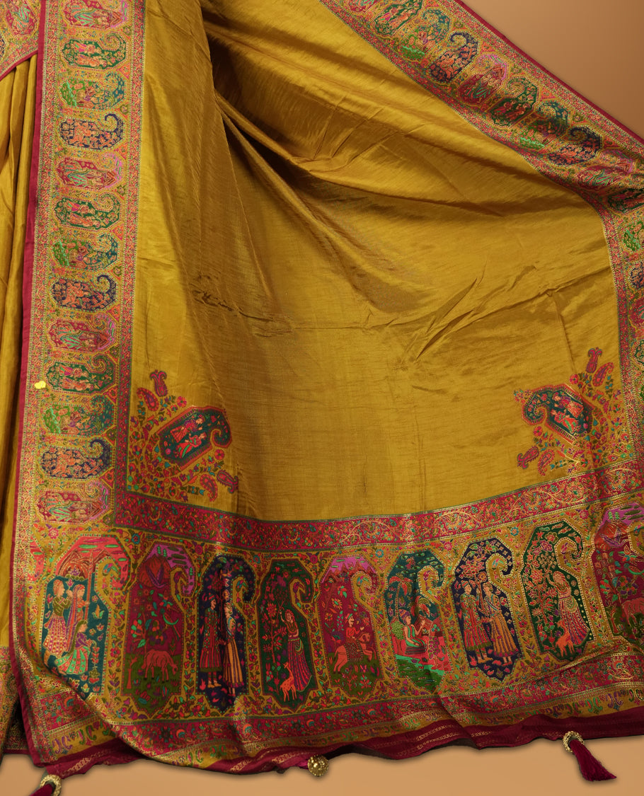 Mustard Pashmina Silk Saree with Plain Body, Featuring Exquisite Multicolor Elephant, Peacock, and Floral Motifs on Rich Pink-Green Zari Border & Grand Pallu, Paired with Matching Blouse Piece