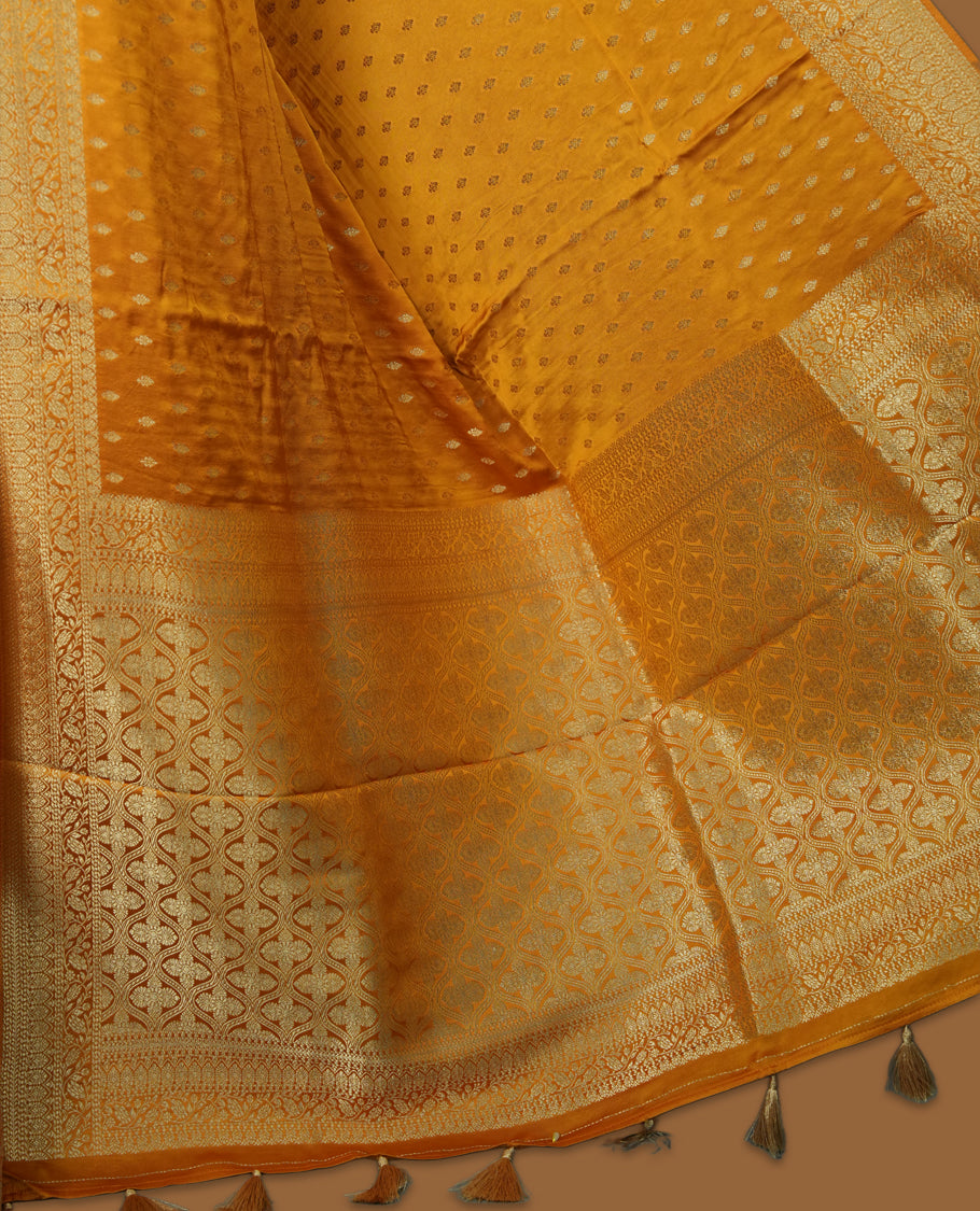 Golden Colour Semi Banarasi Satin Crepe Saree with Silver Zari Leaf Motifs, Traditional Gold Interwoven Pallu, Elaborate Woven Border, Decorative Tassels with Matching Blouse