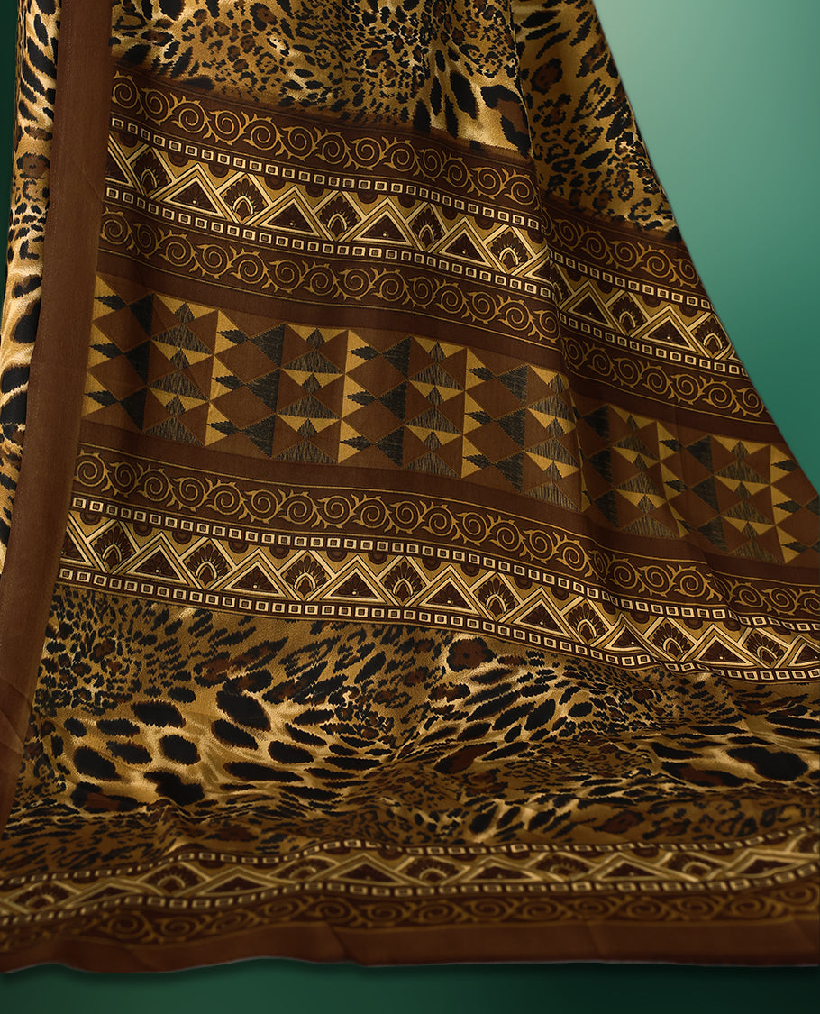Brown colour semi modal silk saree with a striking leopard print across the body, complemented by a deep brown plain border, and paired with a matching blouse