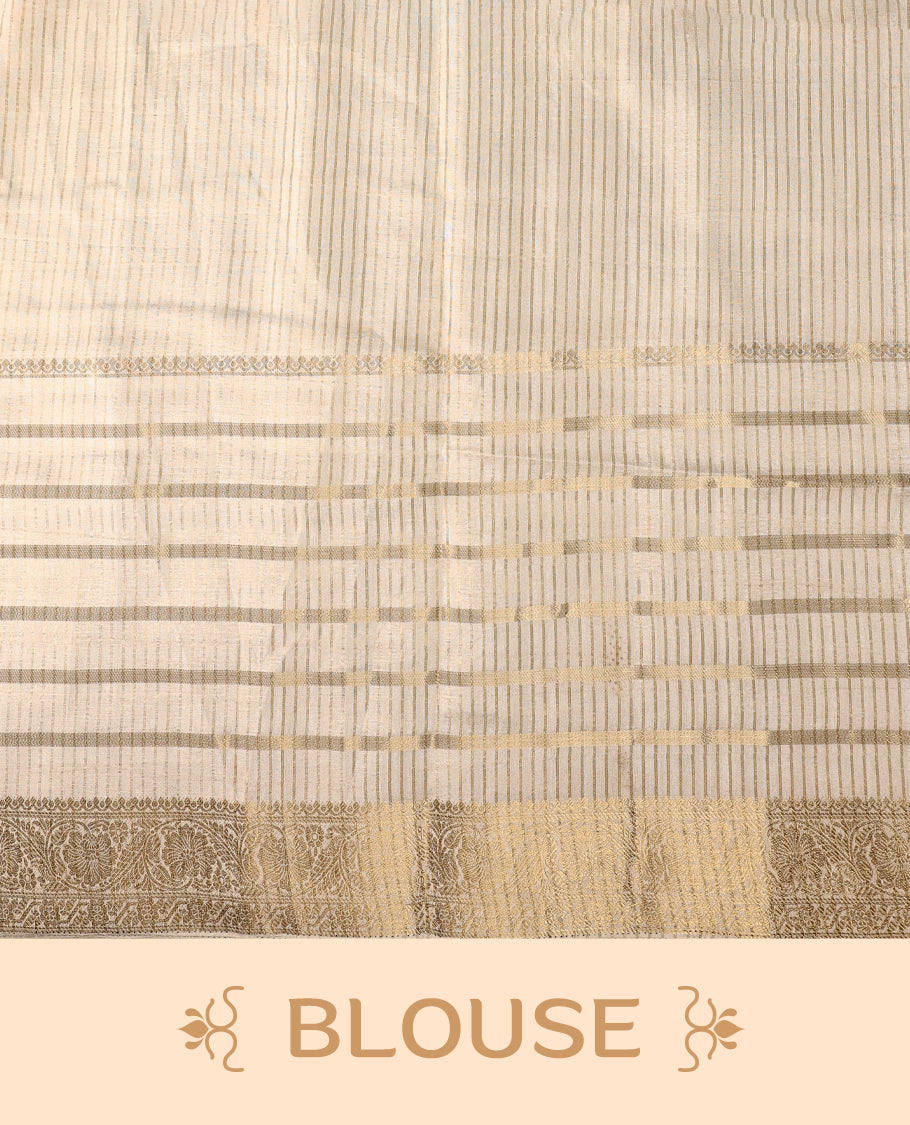 Ivory white Colour Tussar Kerala saree with a sheer, smooth body and soft golden sheen, Accented with fine zari stripes and an intricate floral zari border,Comes paired with a coordinated matching blouse piece.