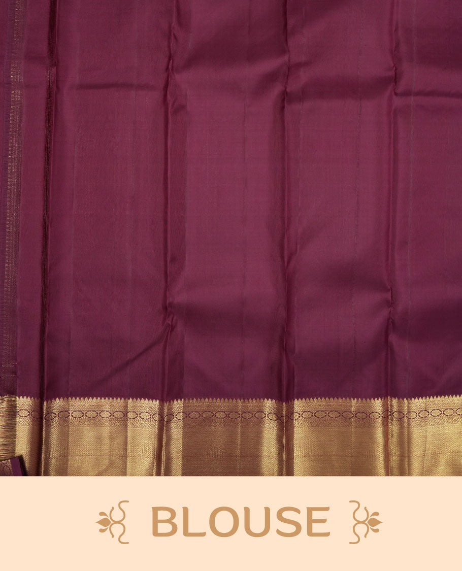 Dark burgundy colour Kanchipuram pattern Manthrakodi saree featuring metallic golden floral and leaf motif zari jaquard with kanchipuram traditional bavanji border and plain blouse piece with zari border.