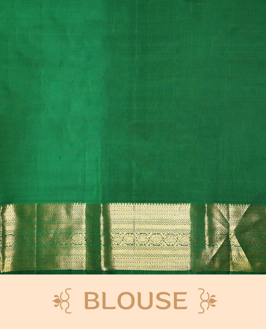 Rani pink pure Kancheepuram saree with gold zari paisley motifs on the body traditional border with floral kodi pattern and green piping, grand pallu with diamond motifs paired with matching blouse