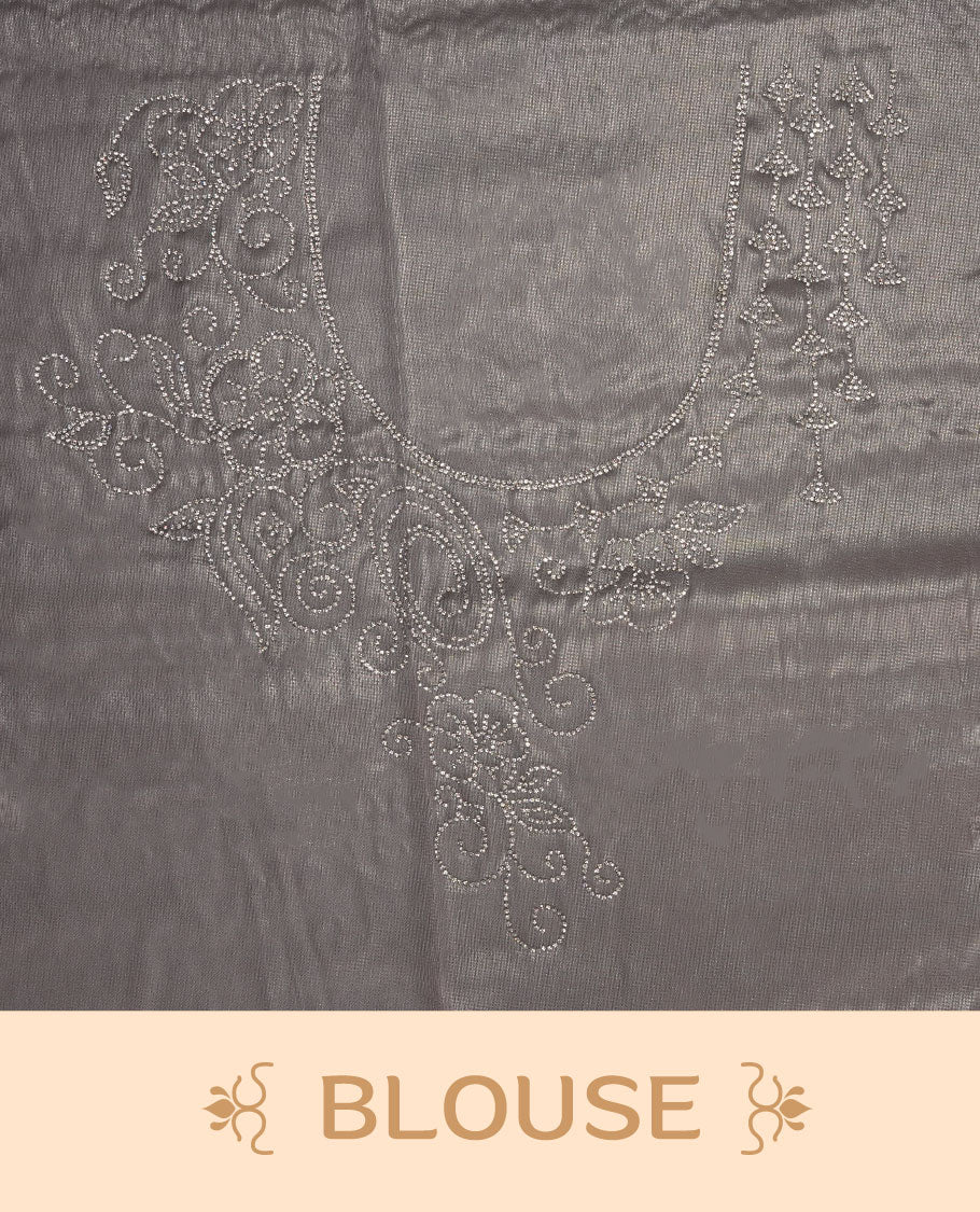 Light lavender colour net shimmer fancy saree adorned with scattered white stone buttas all over the body, paired with a delicate stone worked border and matching blouse.