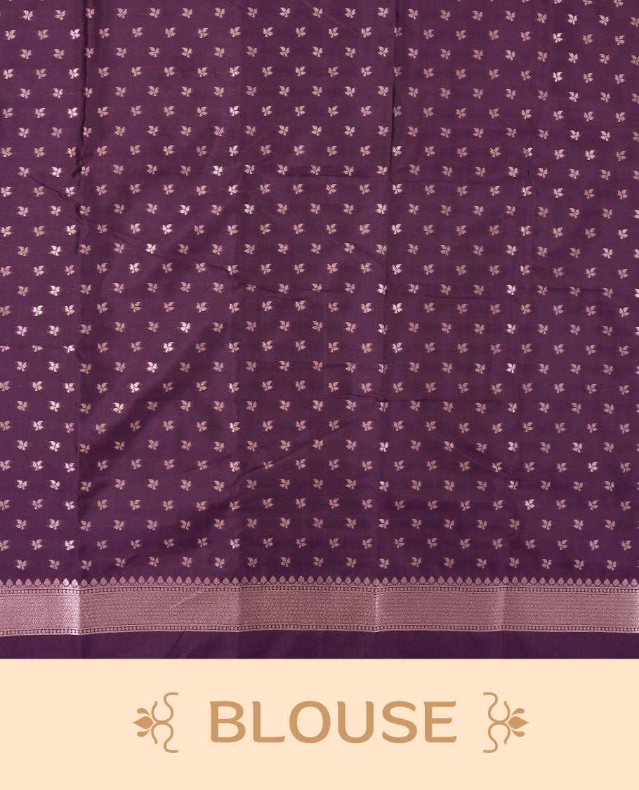 Dark purple colour semi silk saree adorned with elegant leaf motifs on the body, complemented by a shimmering golden zari-woven pallu and border, and paired with a matching blouse
