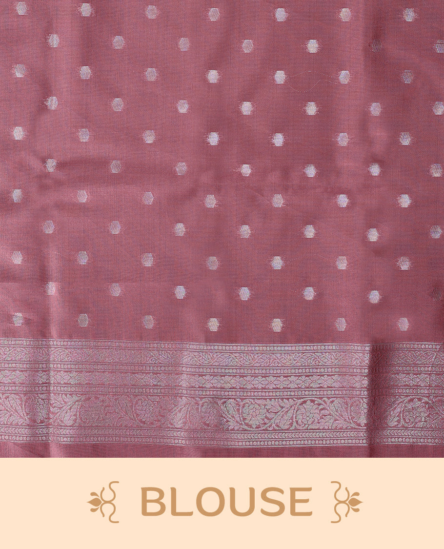Pastel Onion coloured semi silk saree featuring a Silver coloured Zari Diamond design on the body, paired with a Self coloured border and matching blouse.