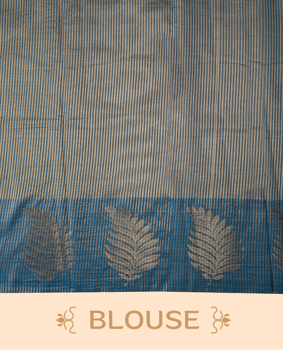 Blue Colour Semi Tussar Silk saree featuring golden zari horizontal lines across the body, adorned with bold Leaf motifs on the border, paired with a matching blouse.