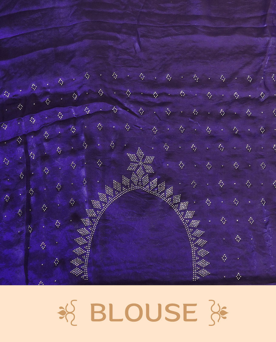Dark violet colour chiffon designer saree, featuring delicate scattered stone detailing all over the body, highlighted with intricate stone work and a heavy geometric stone pattern along the border and pallu, paired with a matching embellished blouse.a