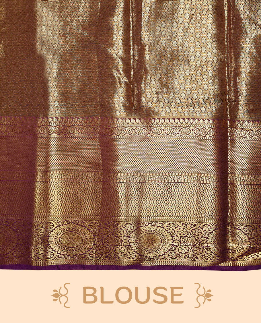 Gold colour tissue brocade saree with gold and silver zari floral pattern on body, gold zari traditional floral and chakkram work royal purple border, rich matching pallu with Antique zari motifs, paired with matching blouse.