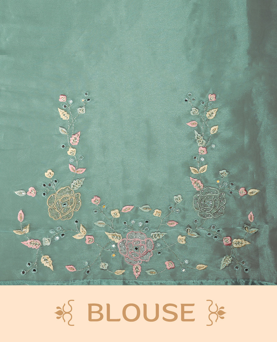Light Blue Colour organza saree featuring delicate floral embroidery with applique, bead, mirror, and thread detailing on the body and scalloped border, lending a soft feminine charm, paired with a matching blouse.