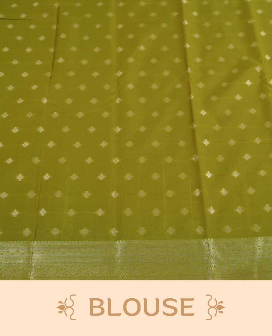 Light cream colour semi silk saree adorned with delicate golden zari buttas across the body, complemented by an elegant olive green pallu and matching border, and paired with a coordinated blouse piece