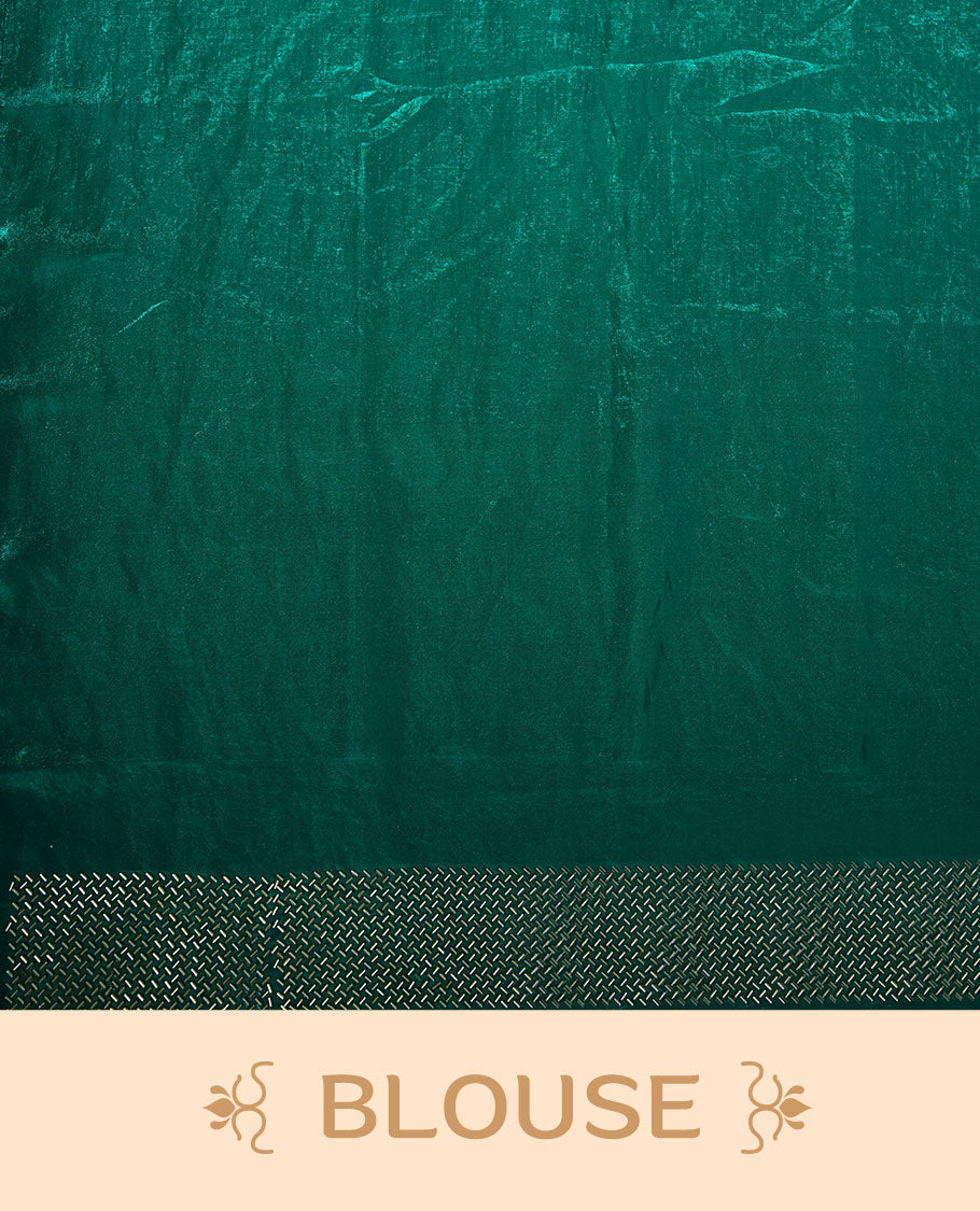 Emerald green chiffon designer saree, featuring dainty scattered stones on the body, enriched with dense stone work and a heavy metallic stone border and pallu, paired with a matching blouse.