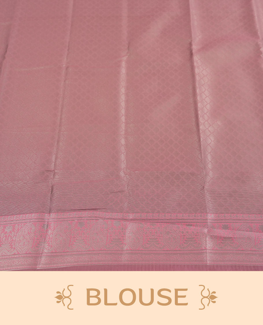 aqua green colour semi silk saree adorned with silver zari designs on the body, complemented by a contrasting pastel pink border and pallu, and paired with a matching blouse piece.