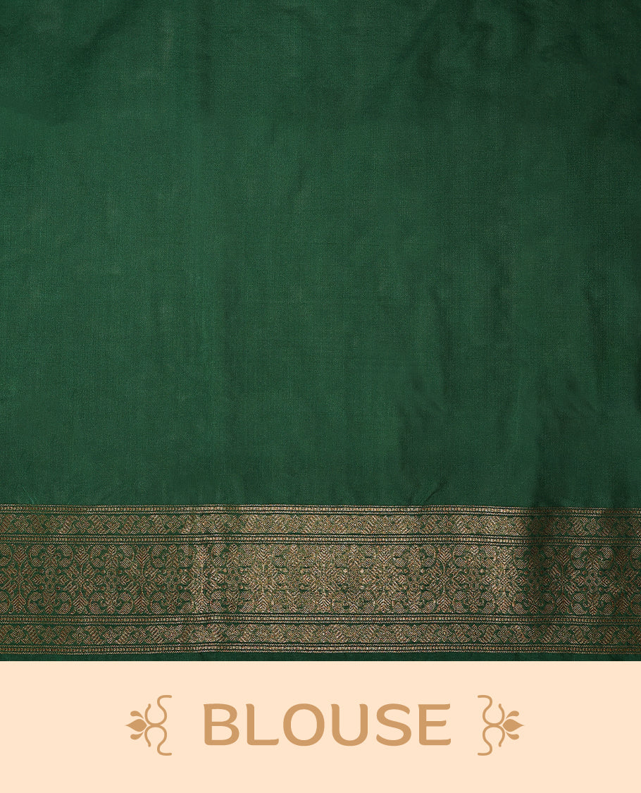 Green colour semi Banaras Katan saree featuring an antique Gold zari jacquard body, complemented by a self colour traditional border with a floral kodi design, paired with a matching blouse