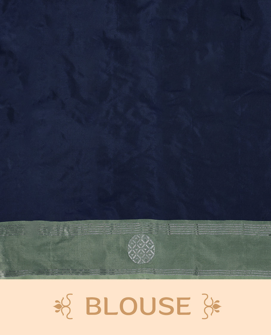 Navy blue Colour semi silk saree features Zari worked body enhanced by a pastel green zari border adorned with Silver circular motifs, and comes with a matching blouse.