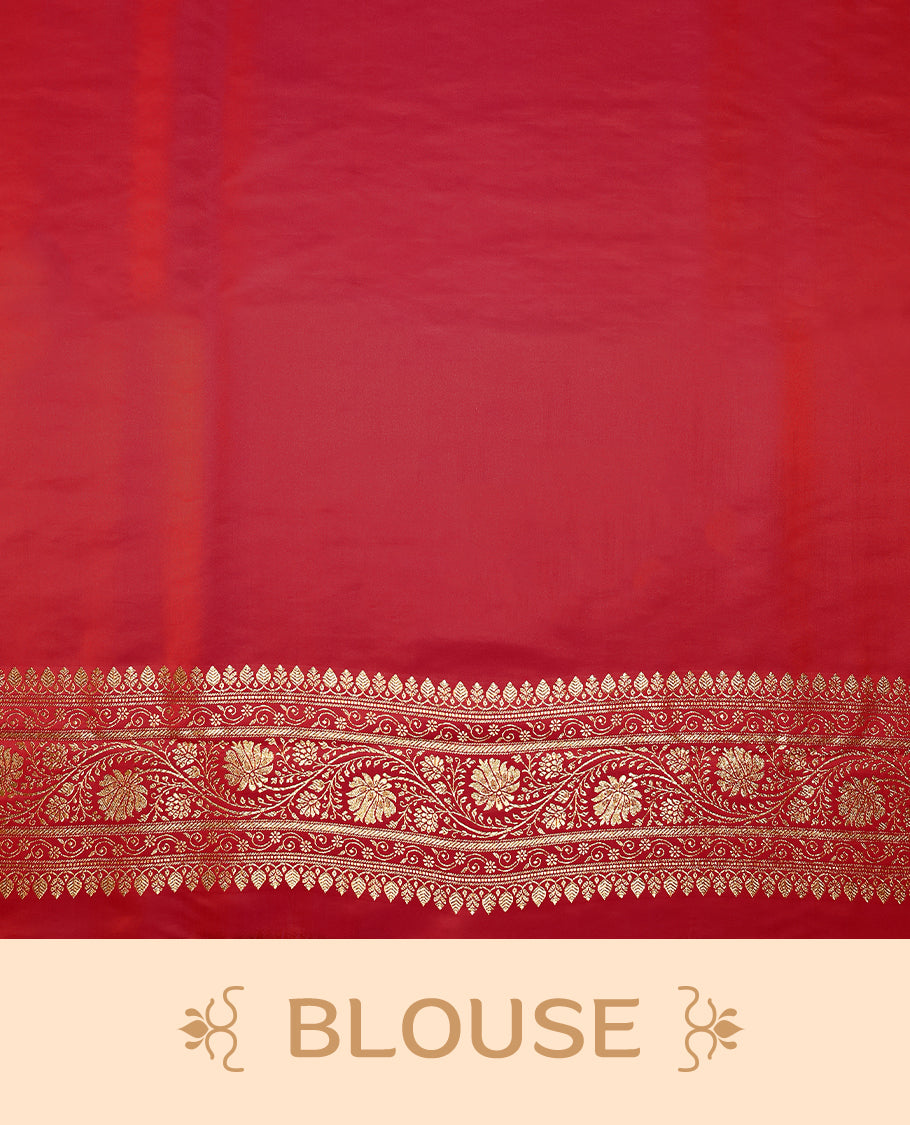 Pinkish red colour semi Banaras satin crepe saree featuring gold zari woven flower motifs across the body, complemented by an intricately designed traditional banarasi border and richly woven pallu, paired with a matching blouse piece.