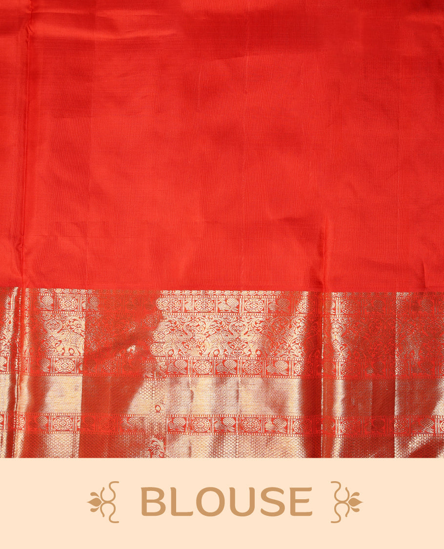 Red colour pure Kancheepuram saree with gold zari Banarasi mango motifs on the body, traditional border with elephant, floral, peacock and chackram motifs grand pallu with peacock and chackra pattern paired with matching blouse