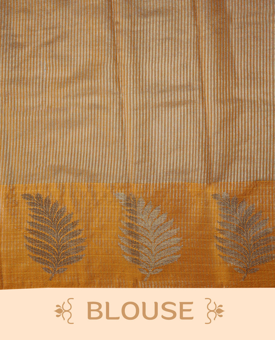 Mustard Colour Semi Tussar Silk saree featuring golden zari horizontal lines across the body, adorned with bold Leaf motifs on the border, paired with a matching blouse.