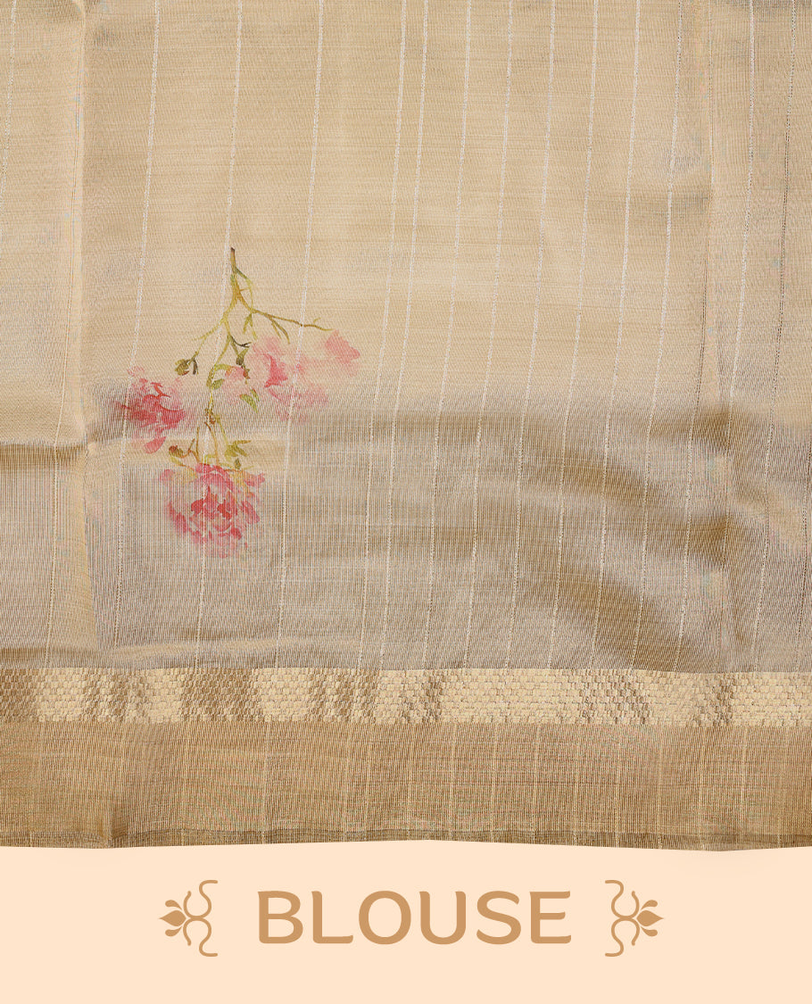 Radiant gold organza Kerala saree adorned with delicate floral accents, a shimmering zari border and a matching blouse