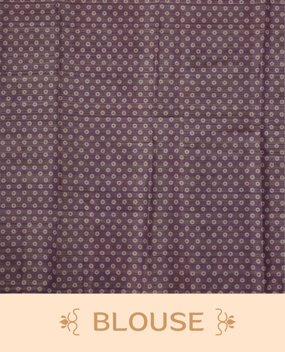 Beige and Lavender colour saree featuring a subtle woven texture & The shaded lavender pallu adds a graceful charm & Finished with delicate tassels and paired with a matching blouse piece.