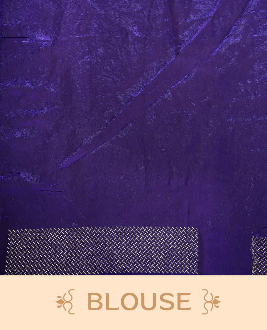 Dark violet colour chiffon designer saree, featuring dainty scattered stones on the body, enriched with dense stone work and a heavy metallic stone border and pallu, paired with a matching blouse.
