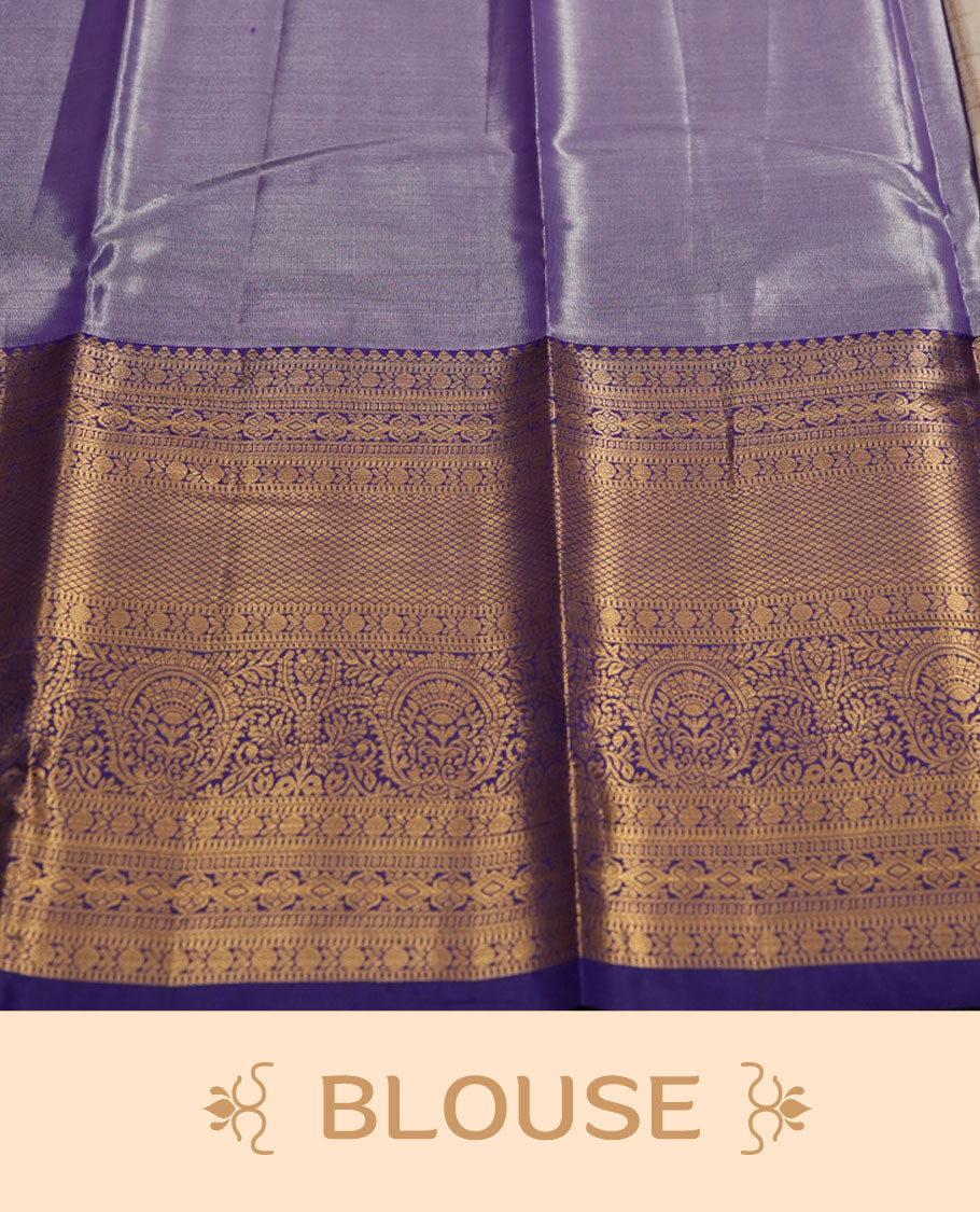 Cream Silk Saree with Purple & Gold Zari Checkered Grid Body, Textured Oval Buttas, Elegant Decorative Pallu Border, Grand Pallu with Ornate Peacock and Floral Motifs in Purple and Gold Tones, and Matching Purple Blouse.