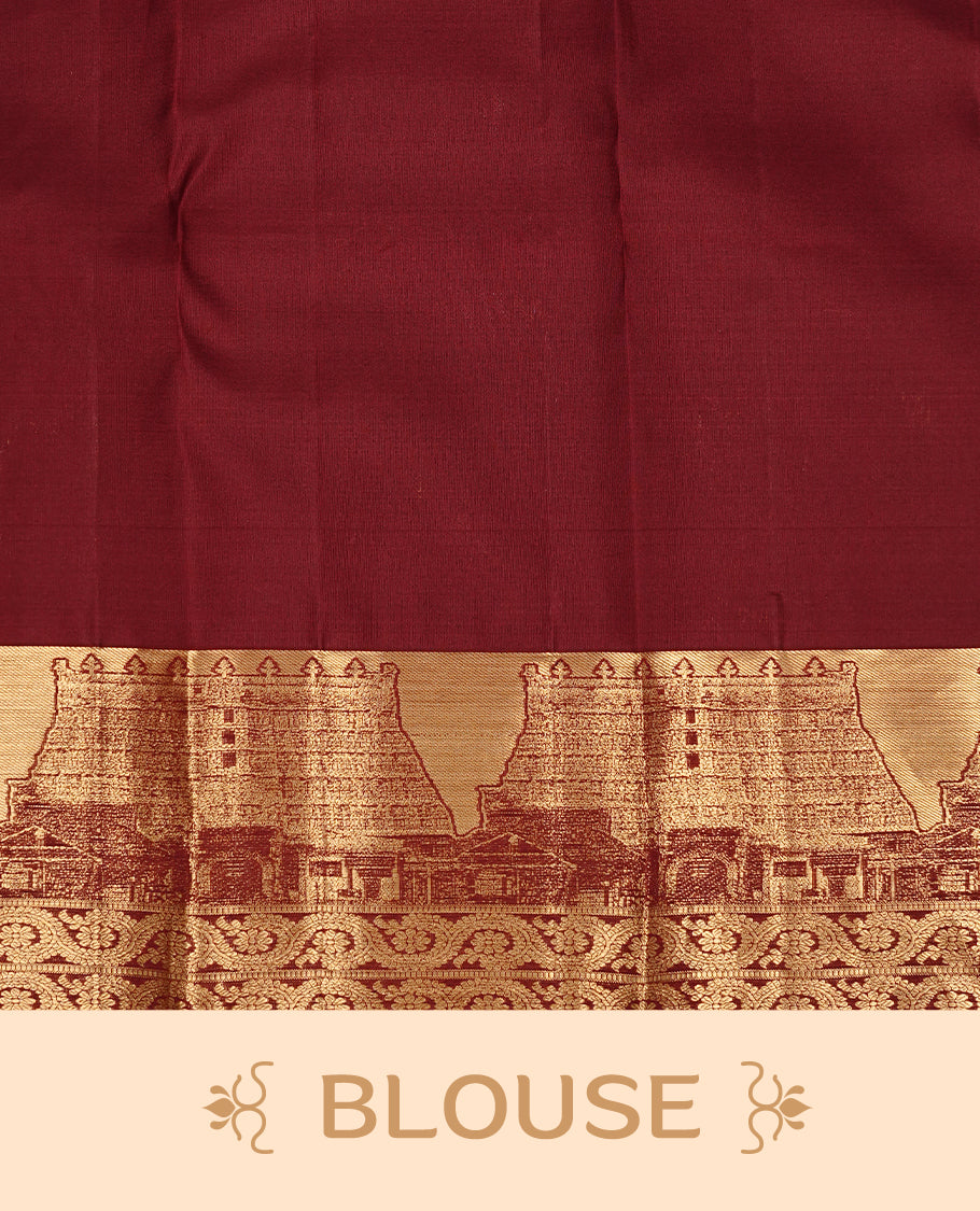 Dark Maroon colour Kanchipuram Samudrika Pattu saree featuring an exclusive gold zari weave of the historic Padmanabhaswamy Temple East Gopuram on the border and pallu, with Anantha Sayanam motif, paired with self colour blouse piece.