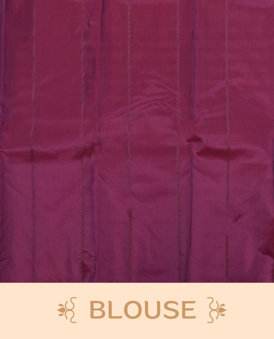 Wine colour semi soft silk saree featuring a self coloured textured patterned body, complemented by self coloured motifes on pallu & border and a matching blouse piece.