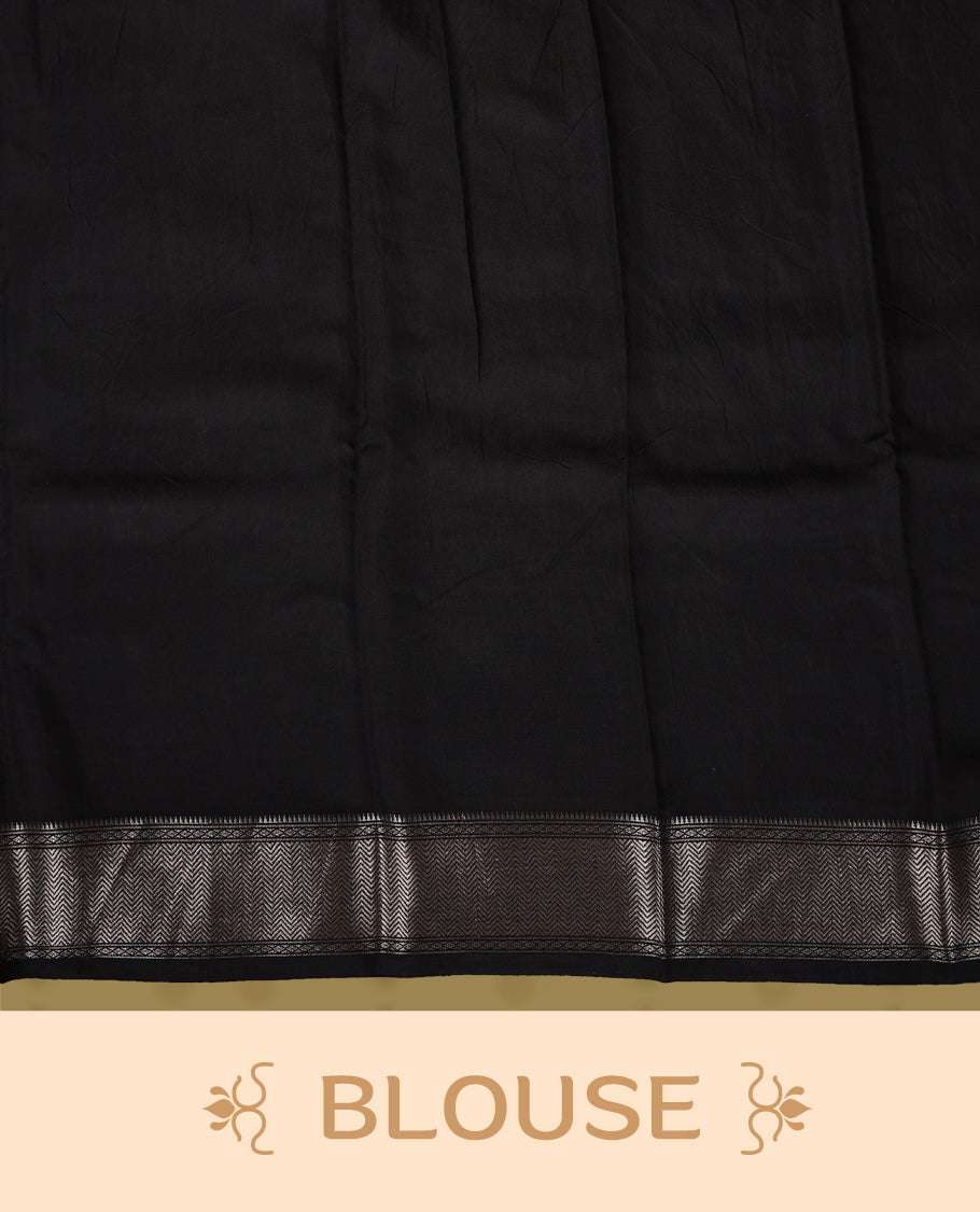 White colour saree with black and mauve floral prints, featuring a contrast zari border and detailed pallu & Comes with a matching blouse piece.